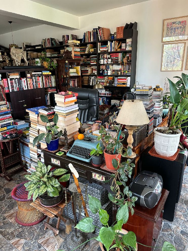 Sundar's book-lined study with a typewriter on the desk